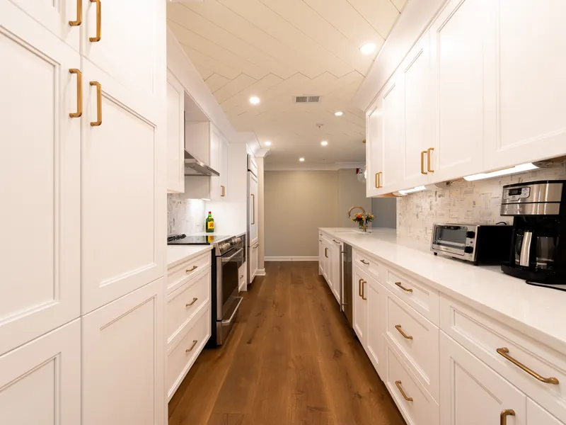 Custom white kitchen cabinets with brass hardware in Sevierville, TN