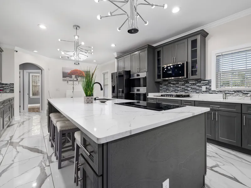 Modern gray kitchen with marble waterfall island in the Smokies