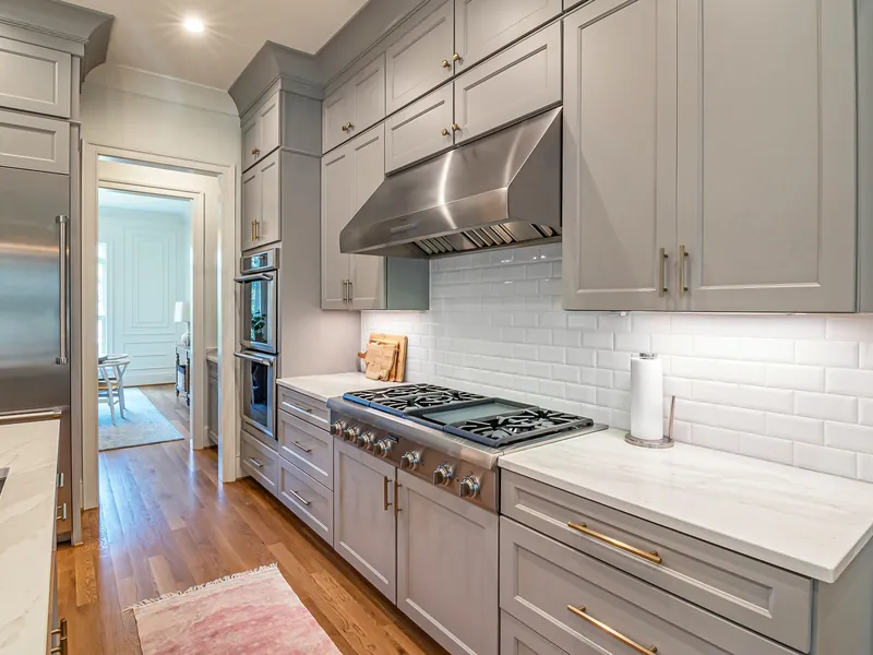 Gray Shaker cabinetry with brass hardware in a Sevierville kitchen